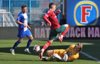 050425 - Carlisle United v Newport County - Sky Bet League 2 - Goalkeeper Gabe Breeze of Carlisle saves from Kieron Evans of Newport