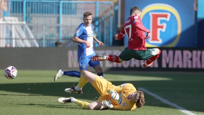 050425 - Carlisle United v Newport County - Sky Bet League 2 - Goalkeeper Gabe Breeze of Carlisle saves from Kieron Evans of Newport
