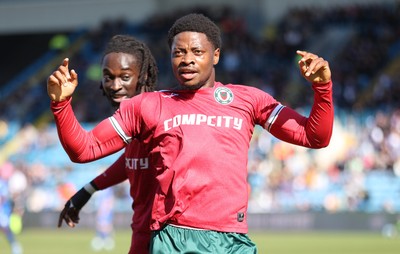 050425 - Carlisle United v Newport County - Sky Bet League 2 - Bobby Kamwa of Newport celebrates scoring his first goal of the match to make it 0-2 with Cameron Antwi of Newport behind