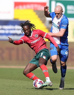 050425 - Carlisle United v Newport County - Sky Bet League 2 - Cameron Antwi of Newport tackles Georgie Kelly of Carlisle