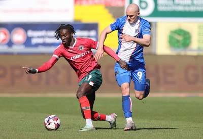 050425 - Carlisle United v Newport County - Sky Bet League 2 - Cameron Antwi of Newport tackles Georgie Kelly of Carlisle
