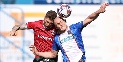 050425 - Carlisle United v Newport County - Sky Bet League 2 - James Clarke of Newport and Georgie Kelly of Carlisle