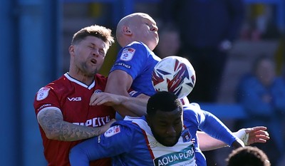 050425 - Carlisle United v Newport County - Sky Bet League 2 - James Clarke of Newport and Georgie Kelly of Carlisle