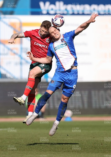 050425 - Carlisle United v Newport County - Sky Bet League 2 - James Clarke of Newport and Georgie Kelly of Carlisle