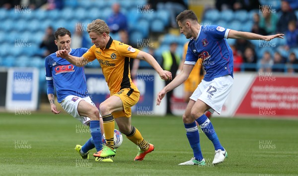 290417 - Carlisle United v Newport County - SkyBet League Two - Alex Samuel of Newport County is challenged by Luke Joyce and Macaulay Gillesphey of Carlisle