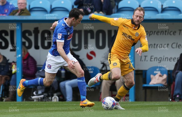 290417 - Carlisle United v Newport County - SkyBet League Two - Sean Rigg of Newport County is challenged by Luke Joyce of Carlisle