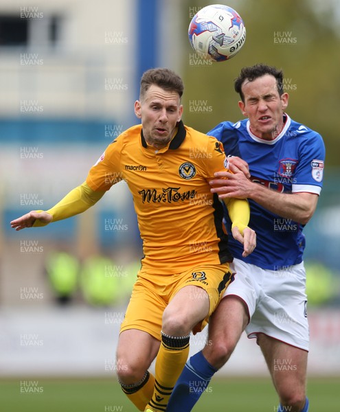 290417 - Carlisle United v Newport County - SkyBet League Two - Mark Randall of Newport County is challenged by Luke Joyce of Carlisle