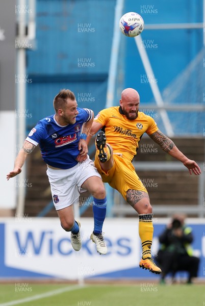 290417 - Carlisle United v Newport County - SkyBet League Two - Danny Grainger of Carlisle and David Pipe of Newport County go up for the ball