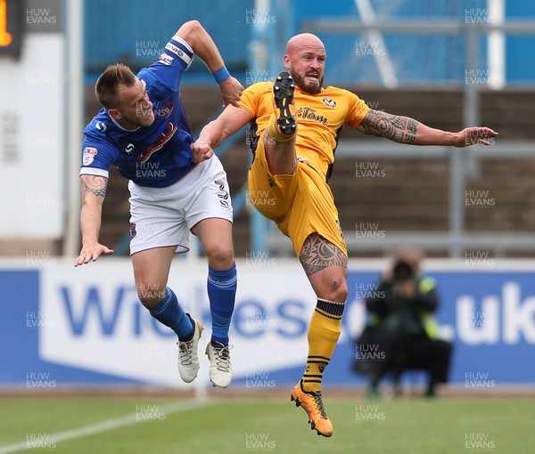 290417 - Carlisle United v Newport County - SkyBet League Two - Danny Grainger of Carlisle and David Pipe of Newport County go up for the ball