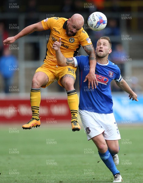 290417 - Carlisle United v Newport County - SkyBet League Two - Danny Grainger of Carlisle is tackled by David Pipe of Newport County