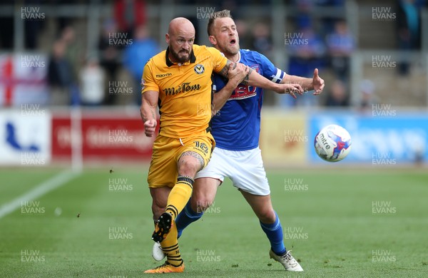 290417 - Carlisle United v Newport County - SkyBet League Two - Danny Grainger of Carlisle is tackled by David Pipe of Newport County