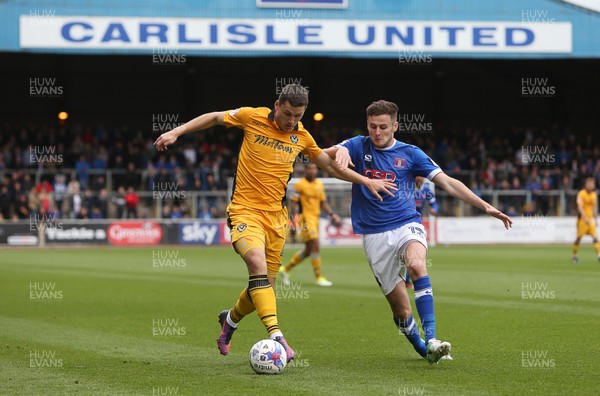 290417 - Carlisle United v Newport County - SkyBet League Two - Aaron Williams of Newport County is tackled by Macaulay Gillesphey of Carlisle