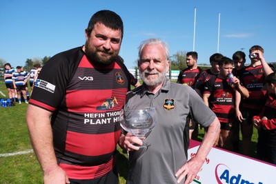 250426 - Fishguard v Carmarthen Athletic - Admiral National League 2 West - Carmarthen Athletic captain Richard Davies and Carmarthen Athletic President Dr Chris John with the league trophy