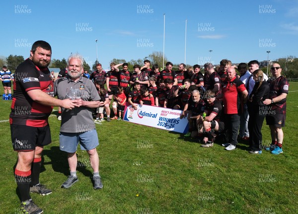 250426 - Fishguard v Carmarthen Athletic - Admiral National League 2 West - Carmarthen Athletic captain Richard Davies is presented with the league trophy by Carmarthen Athletic President Dr Chris John