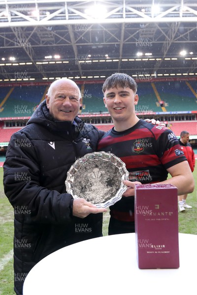 290324 - Carmarthen Athletic v Bargoed - WRU Boys U18 Plate Final - Athletic Captain Lewys Thomas receives the trophy from Terry Cobner of the WRU