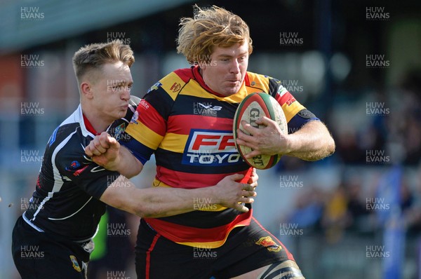 010417 Carmarthen Quins v Bedwas - Fosters Challenge Cup Final - Andrew Green of Carmarthen Quins bursts out of Matthew John of Bedwas tackle