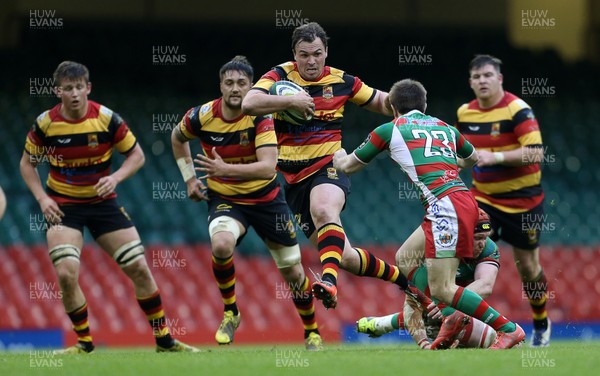 010516 - Carmarthen Quins v Llandovery - SSE SWALEC Cup Final - Rhys Williams of Carmarthen smashes past Lee Rees of Llandovery