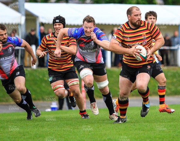 250415 - Carmarthen Quins v Pontypridd - Principality Premiership - Prop Ian Jones of Carmarthen looks to offload