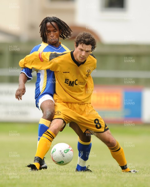 12.07.08 - Carmarthen Town v Cardiff City - Preseason Friendly - Carmarthen's Tim Hicks holds off Miguel Comminges 