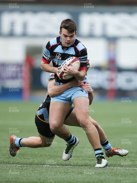 061217 - Cardiff and Vale College v Whitchurch High School, WRU Schools and Colleges League - Jac Roberts of CAVCis tackled by Will Young of Whitchurch