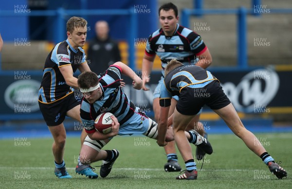 061217 - Cardiff and Vale College v Whitchurch High School, WRU Schools and Colleges League - Ellis Reed of CAVC is tackled as he charges forward