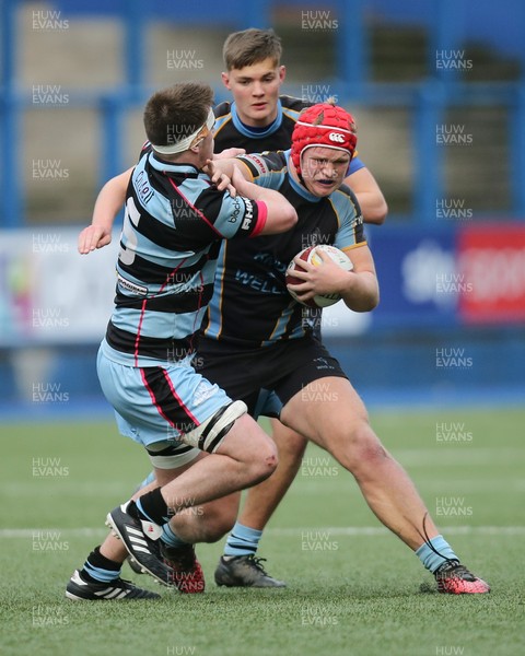 061217 - Cardiff and Vale College v Whitchurch High School, WRU Schools and Colleges League - Lewis Jameson of Whitchurch charges into Cameron Roy of CAVC