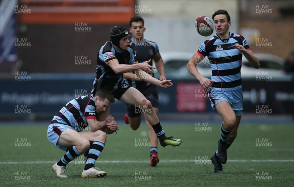 061217 - Cardiff and Vale College v Whitchurch High School, WRU Schools and Colleges League - Sam Gasston of Whitchurch releases the ball as he is tackled