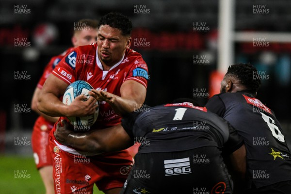 110322 - Cell C Sharks v Scarlets - United Rugby Championship - Dan Davis of Scarlets is tackled by Ox Nche of Sharks