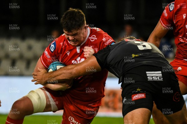 110322 - Cell C Sharks v Scarlets - United Rugby Championship - Jac Price of Scarlets is tackled by Thomas du Toit of Sharks