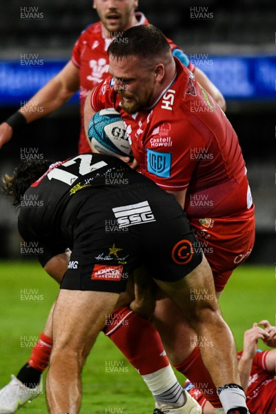 110322 - Cell C Sharks v Scarlets - United Rugby Championship - Steff Thomas of Scarlets is tackled by Marius Louw of Sharks