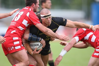 10.08.08 -  Celtic Crusaders v Leigh Centurions. Crusaders Jordan James is held by the Centurions defence 