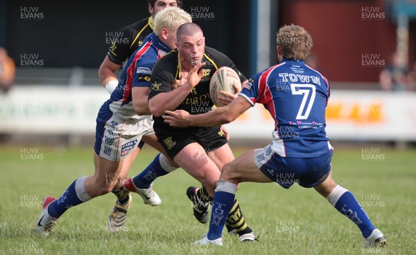 23.06.07.. Celtic Crusaders v Workington Town, Rugby League Crusaders Neil Budworth tries to hold off Shaun Lunt and Martin Keavney (7) 