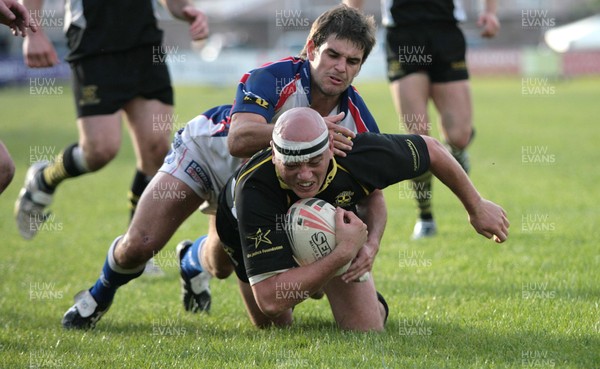 23.06.07.. Celtic Crusaders v Workington Town, Rugby League Crusaders Jace Van Dijk is stopped by Carl Forber 