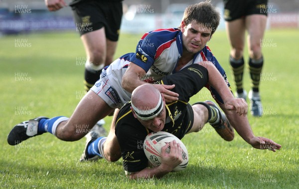 23.06.07.. Celtic Crusaders v Workington Town, Rugby League Crusaders Jace Van Dijk is stopped by Carl Forber 