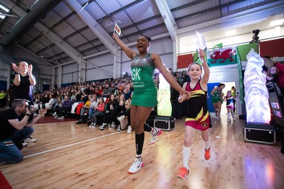 270323 - Celtic Dragons v Strathclyde Sirens - Vitality Netball Super League - Shaquanda Greene-Noel of Celtic Dragons with mascot