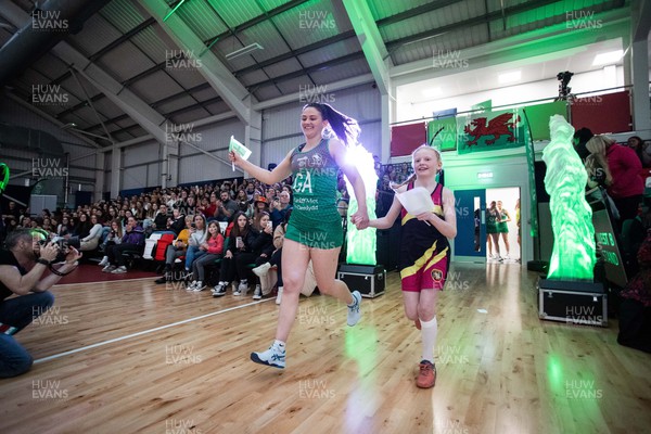 270323 - Celtic Dragons v Strathclyde Sirens - Vitality Netball Super League - Laura Rudland of Celtic Dragons with mascot