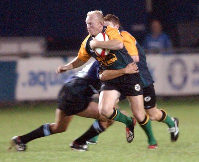 190903 - Celtic Warriors v Glasgow - Celtic Cup - Neil Jenkins makes it past tackler Calvin Howarth