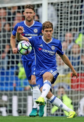 231016 - Chelsea vs Manchester United - Premier League -Marcos Alonso of Chelsea watched by team mate Gary Cahill