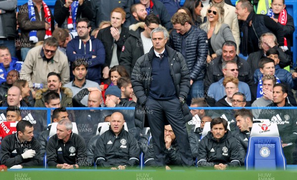 231016 - Chelsea vs Manchester United - Premier League -Jose Mourinho cuts a forlorn figure in the dug-out