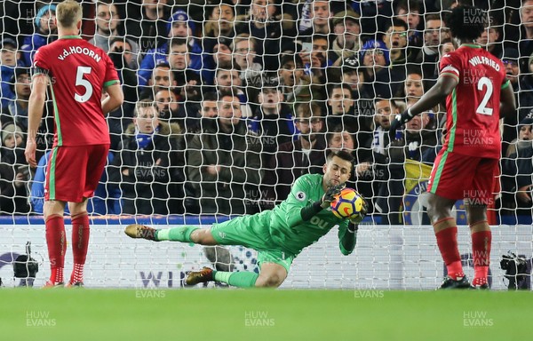 291117 - Chelsea v Swansea City, Premier League - Swansea City goalkeeper Lukasz Fabianski dives to make a save