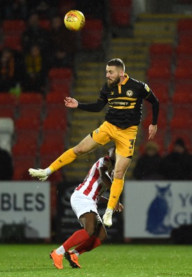 041218 - Cheltenham Town v Newport County - Checkatrade Trophy - Dan Butler of Newport County heads the ball