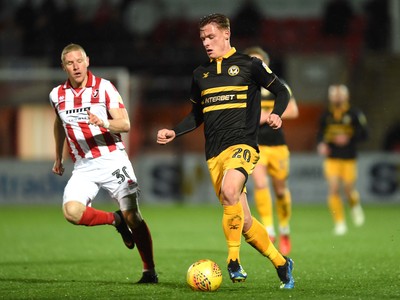 041218 - Cheltenham Town v Newport County - Checkatrade Trophy - Craig Alcock of Cheltenham Town and Cameron Pring of Newport County compete