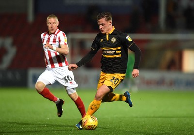 041218 - Cheltenham Town v Newport County - Checkatrade Trophy - Craig Alcock of Cheltenham Town and Cameron Pring of Newport County compete