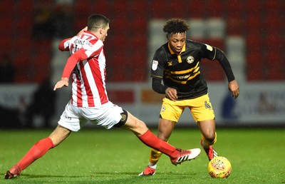 041218 - Cheltenham Town v Newport County - Checkatrade Trophy - Antoine Semenyo of Newport County gets past Ben Tozer of Cheltenham Town