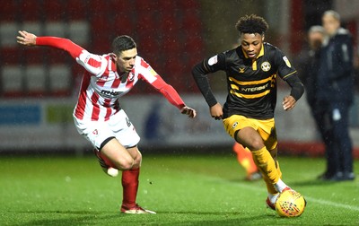 041218 - Cheltenham Town v Newport County - Checkatrade Trophy - Antoine Semenyo of Newport County gets past Ben Tozer of Cheltenham Town