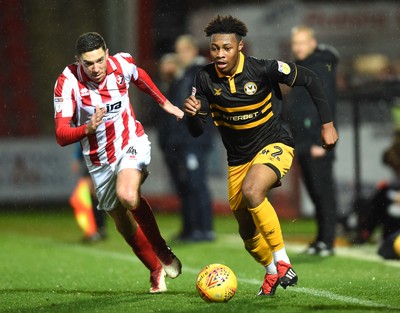 041218 - Cheltenham Town v Newport County - Checkatrade Trophy - Antoine Semenyo of Newport County gets past Ben Tozer of Cheltenham Town