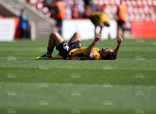 100824 - Cheltenham Town v Newport County, SkyBet League Two - Dejected Aaron Wildig of Newport County at full time