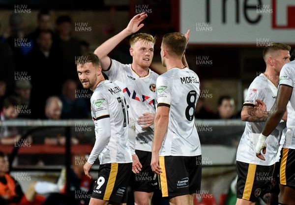 101023 - Cheltenham Town v Newport County - EFL Trophy - Will Evans of Newport County celebrates scoring their second goal