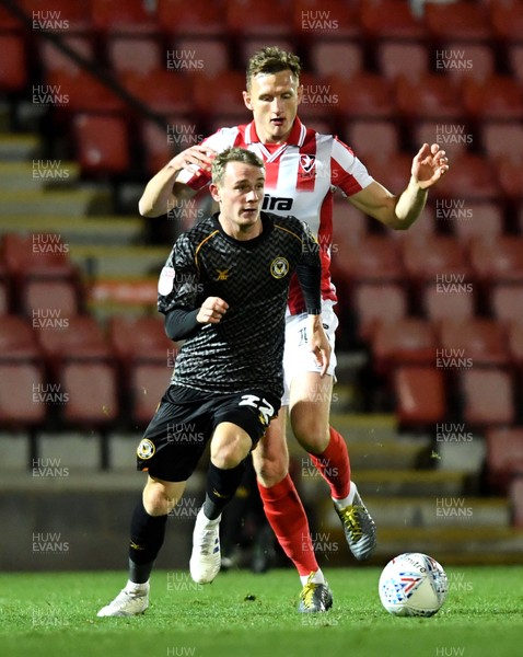 121119 - Cheltenham Town v Newport County - Leasingcom Trophy - Taylor Maloney of Newport County is challenged by George Lloyd of Cheltenham Town