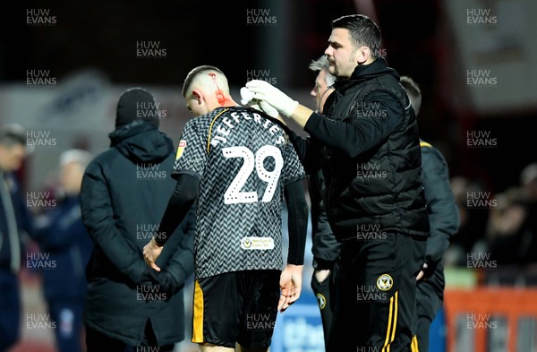 121119 - Cheltenham Town v Newport County - Leasingcom Trophy - Dom Jeffries of Newport County is treated for a cut to the head